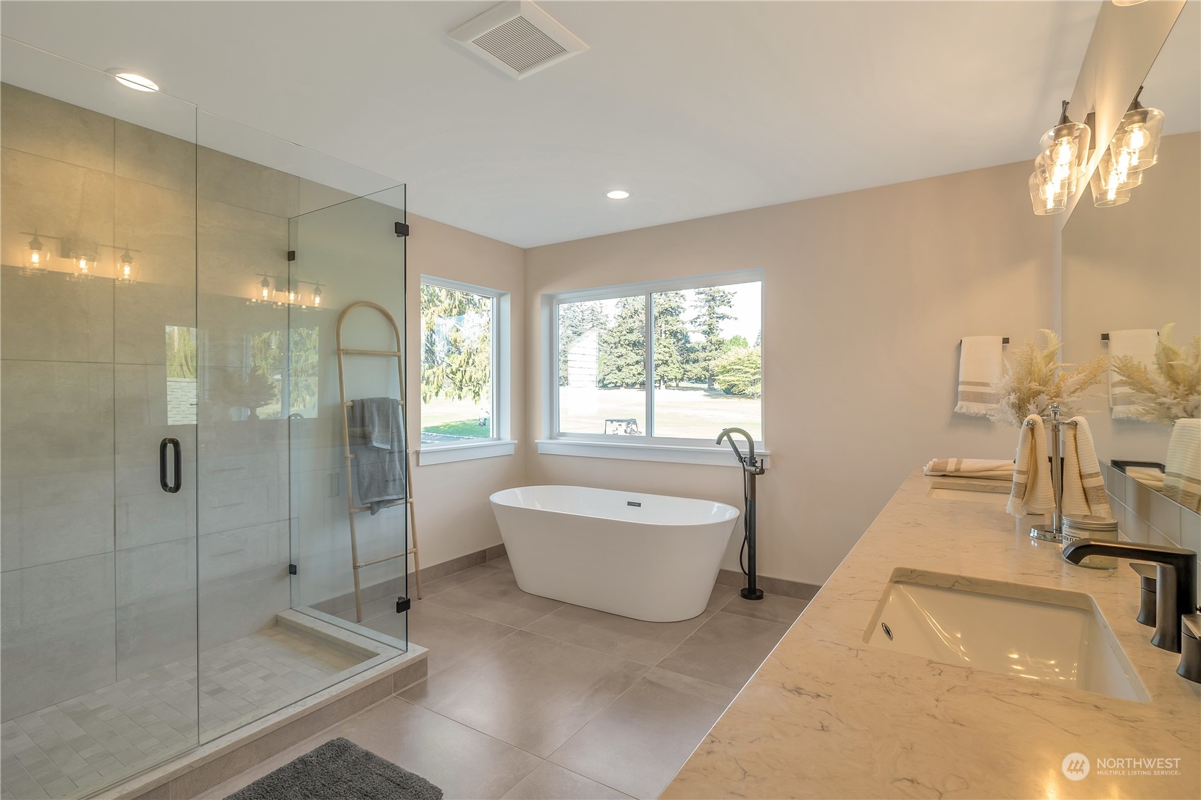 421 Rockefeller Avenue Everett, WA 98201 - Photo 23 of 35 a spacious bathroom with a bathtub shower sink and mirror