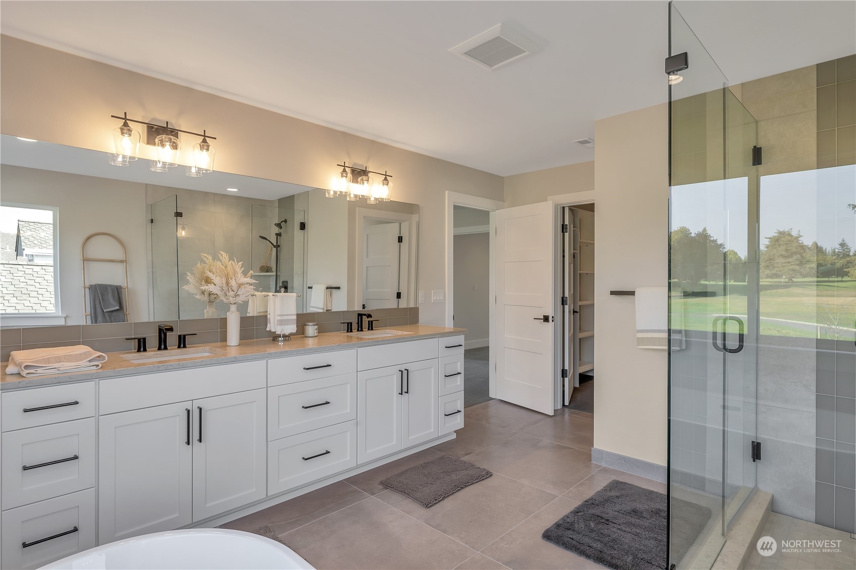 421 Rockefeller Avenue Everett, WA 98201 - Photo 24 of 35 a spacious bathroom with a granite countertop sink mirror and shower