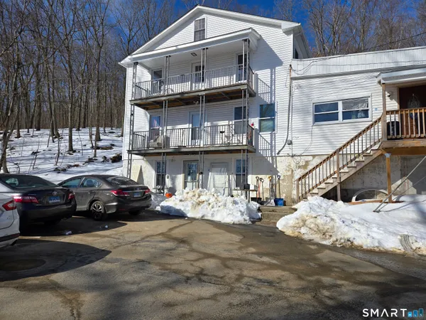 a view of a car park in front of house