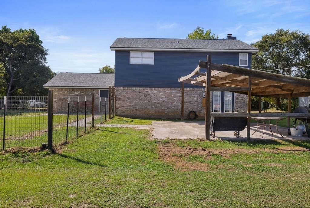 2098 Cedar Creek Road Hearne, TX 77859 - Photo 16 of 18 a view of a house with a yard