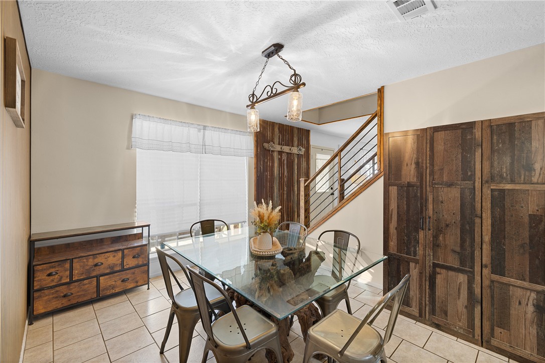 2098 Cedar Creek Road Hearne, TX 77859 - Photo 8 of 18 a view of a room that has a table and chairs