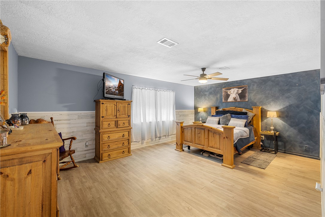 2098 Cedar Creek Road Hearne, TX 77859 - Photo 10 of 18 a bedroom with furniture and a dresser