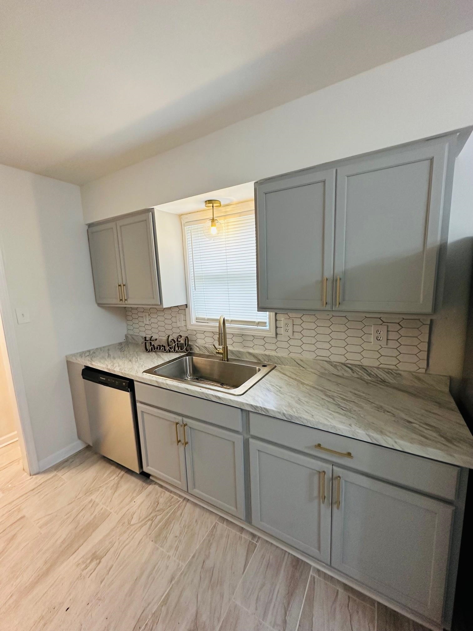 507 Tonto Road Memphis, TN 38109 - Photo 6 of 15 a kitchen with a sink cabinets and appliances