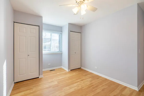 a bedroom with a bed and a chair