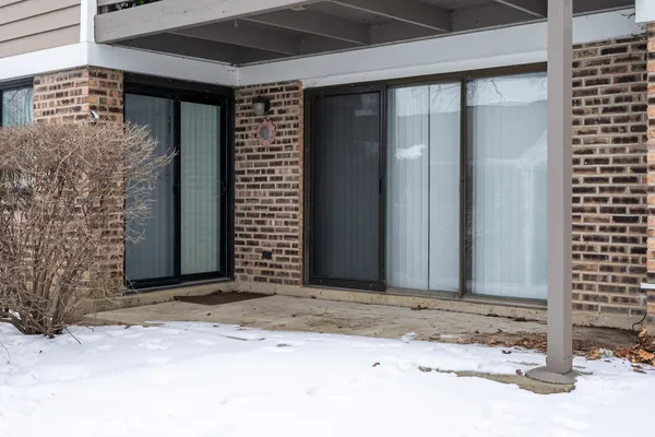 an empty room with wooden floor and closet