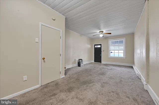 a view of an empty room and window
