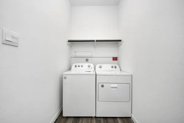 a utility room with dryer and washer