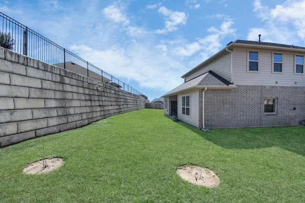 a backyard of a house with lots of green space