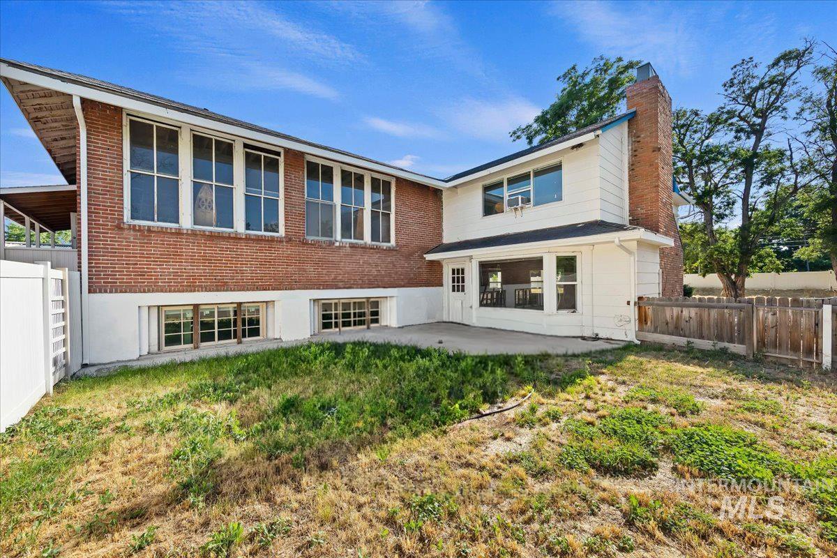2160 South Five Mile Road Boise, ID 83709 - Photo 35 of 41 Expansive backyard featuring a partial brick exterior with multiple windows