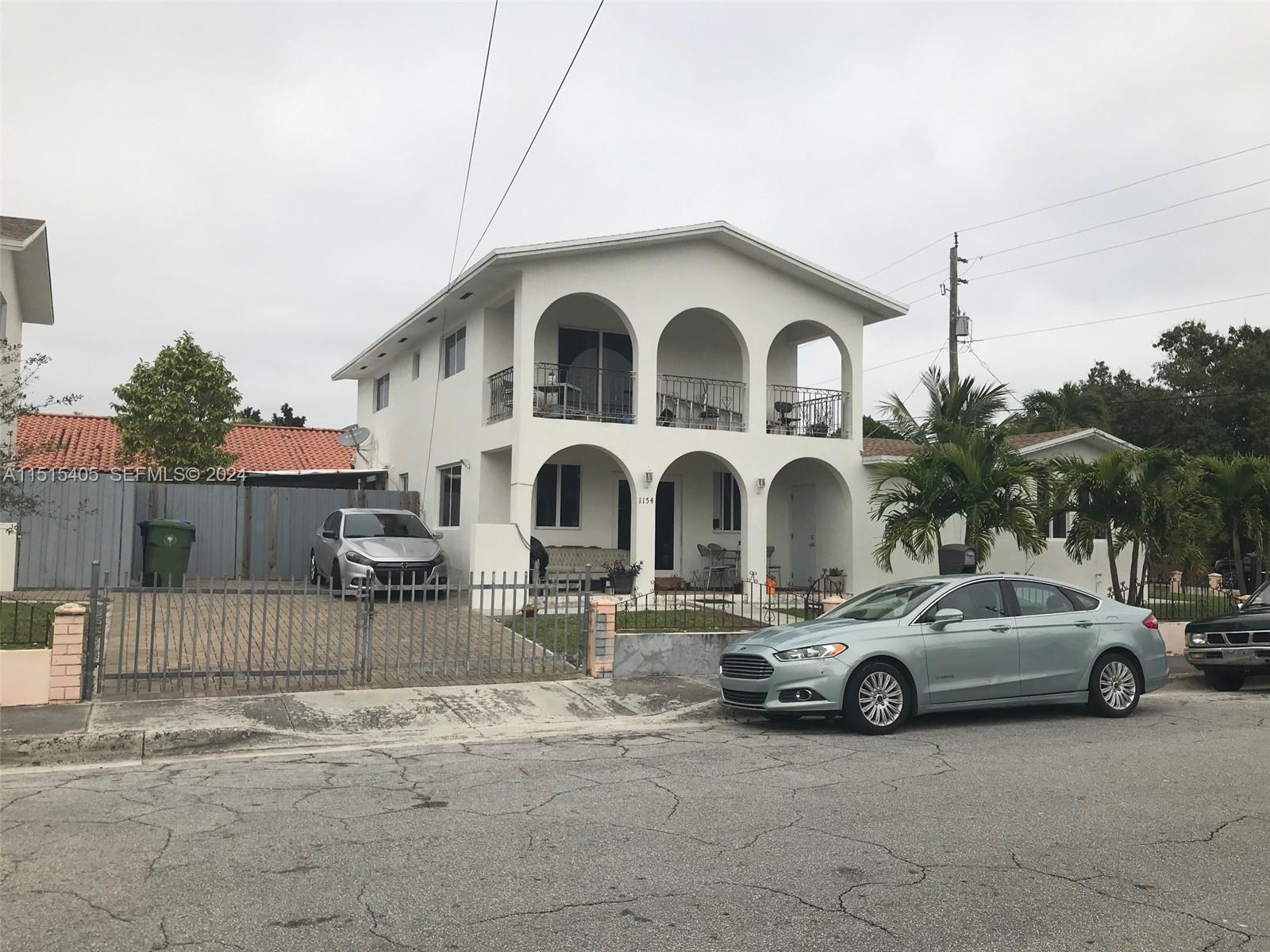 1355 Southwest 12th Street Miami, FL 33135 - Photo 13 of 18 a view of a car parked in front of a house