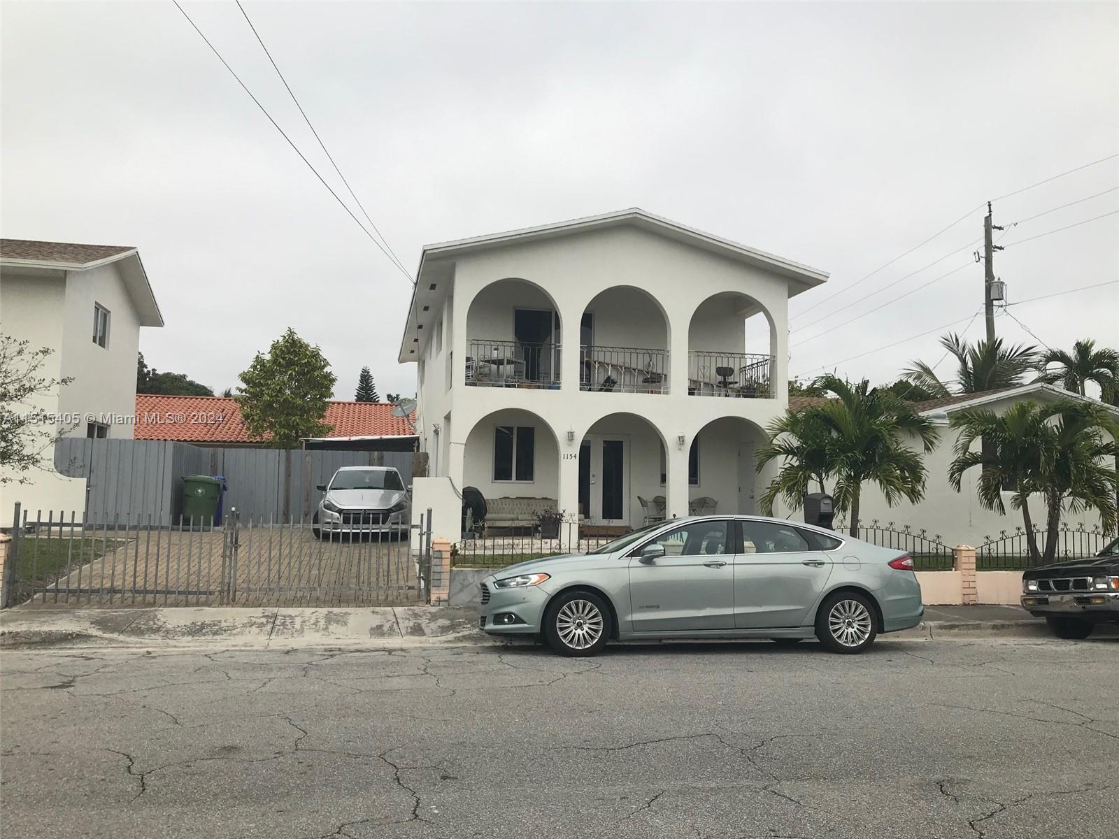 1355 Southwest 12th Street Miami, FL 33135 - Photo 14 of 18 a view of a car parked in front of a house