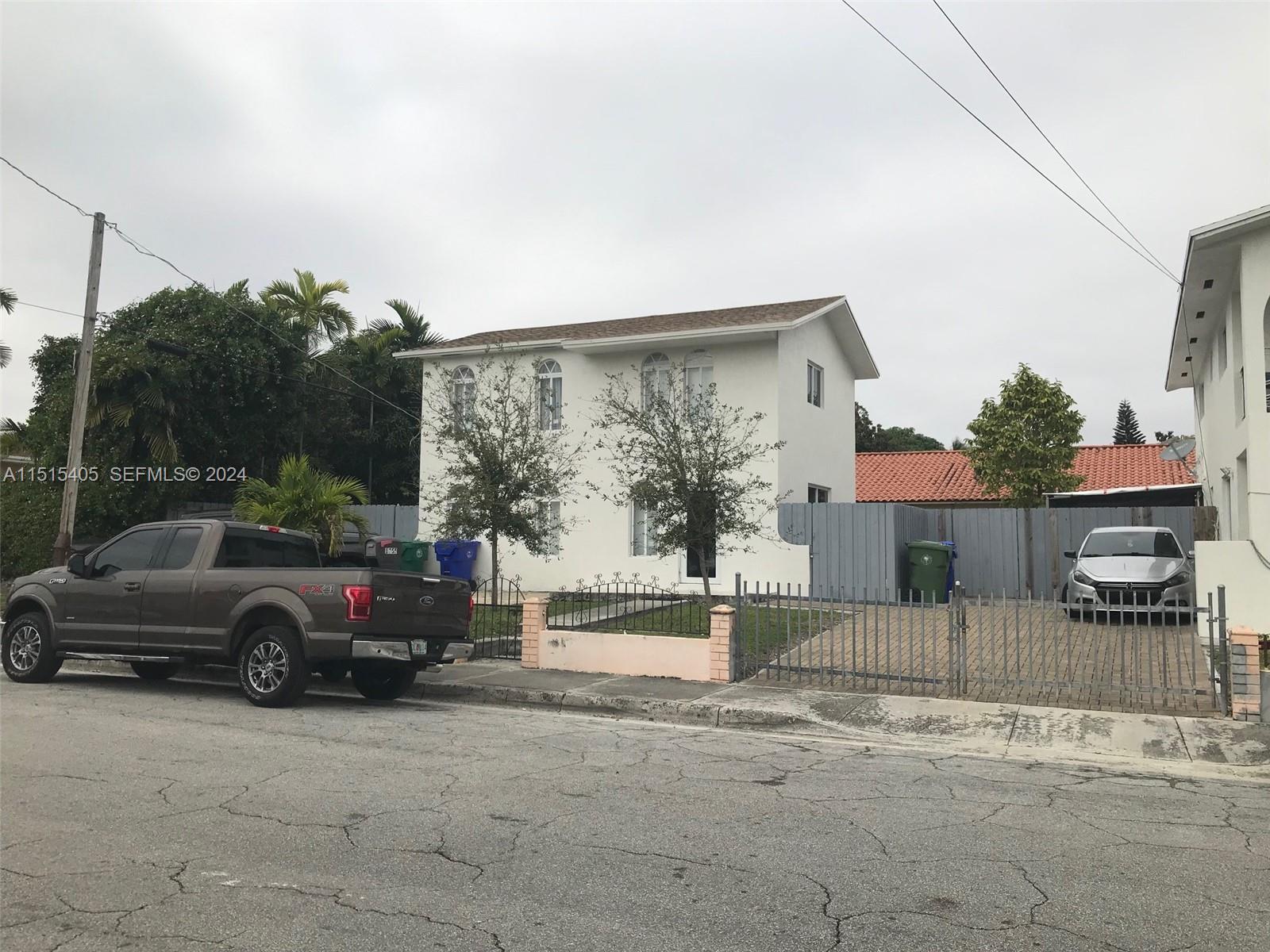 1355 Southwest 12th Street Miami, FL 33135 - Photo 15 of 18 a view of a car parked in front of a house