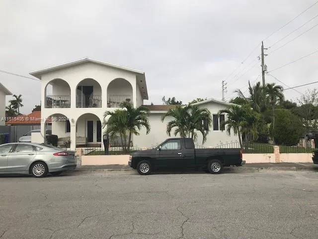 a car parked in front of a house