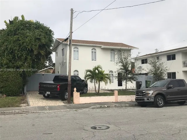 a view of a car parked in front of a house