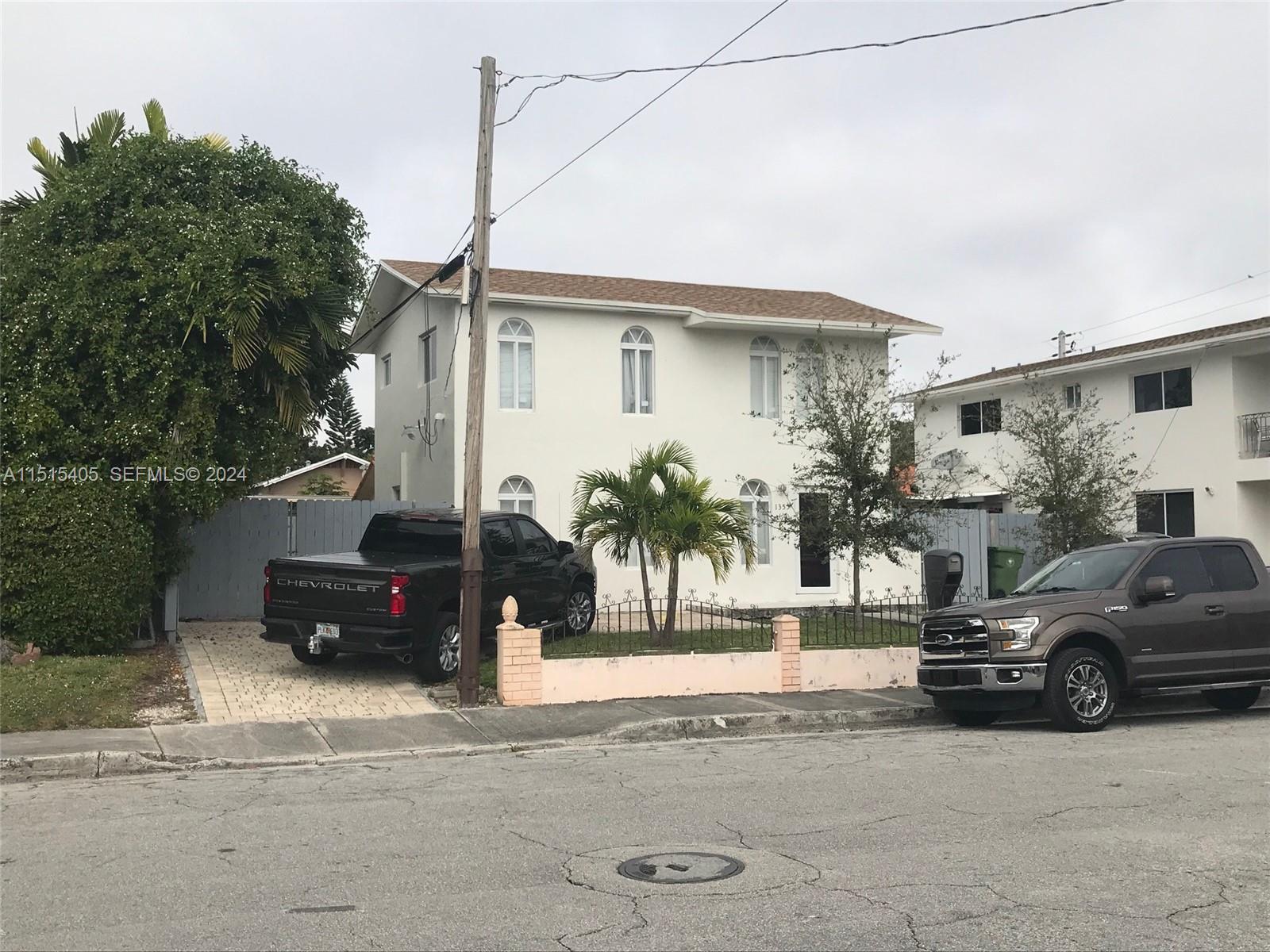 1355 Southwest 12th Street Miami, FL 33135 - Photo 8 of 18 a view of a car parked in front of a house
