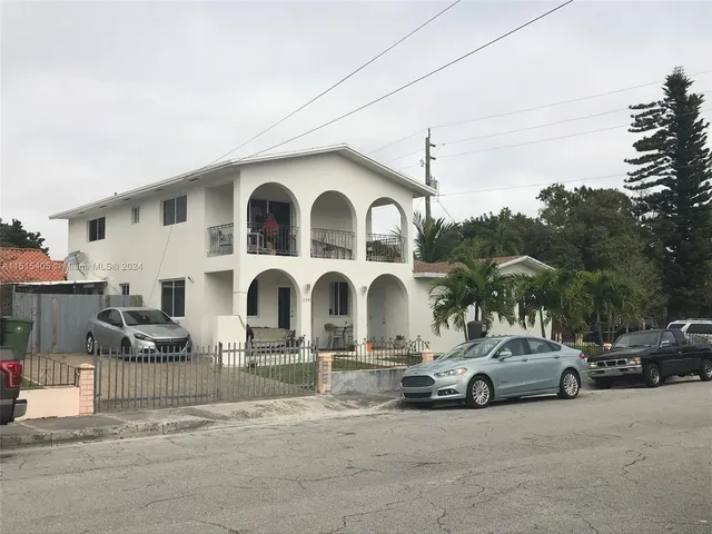 a view of a car parked in front of a house