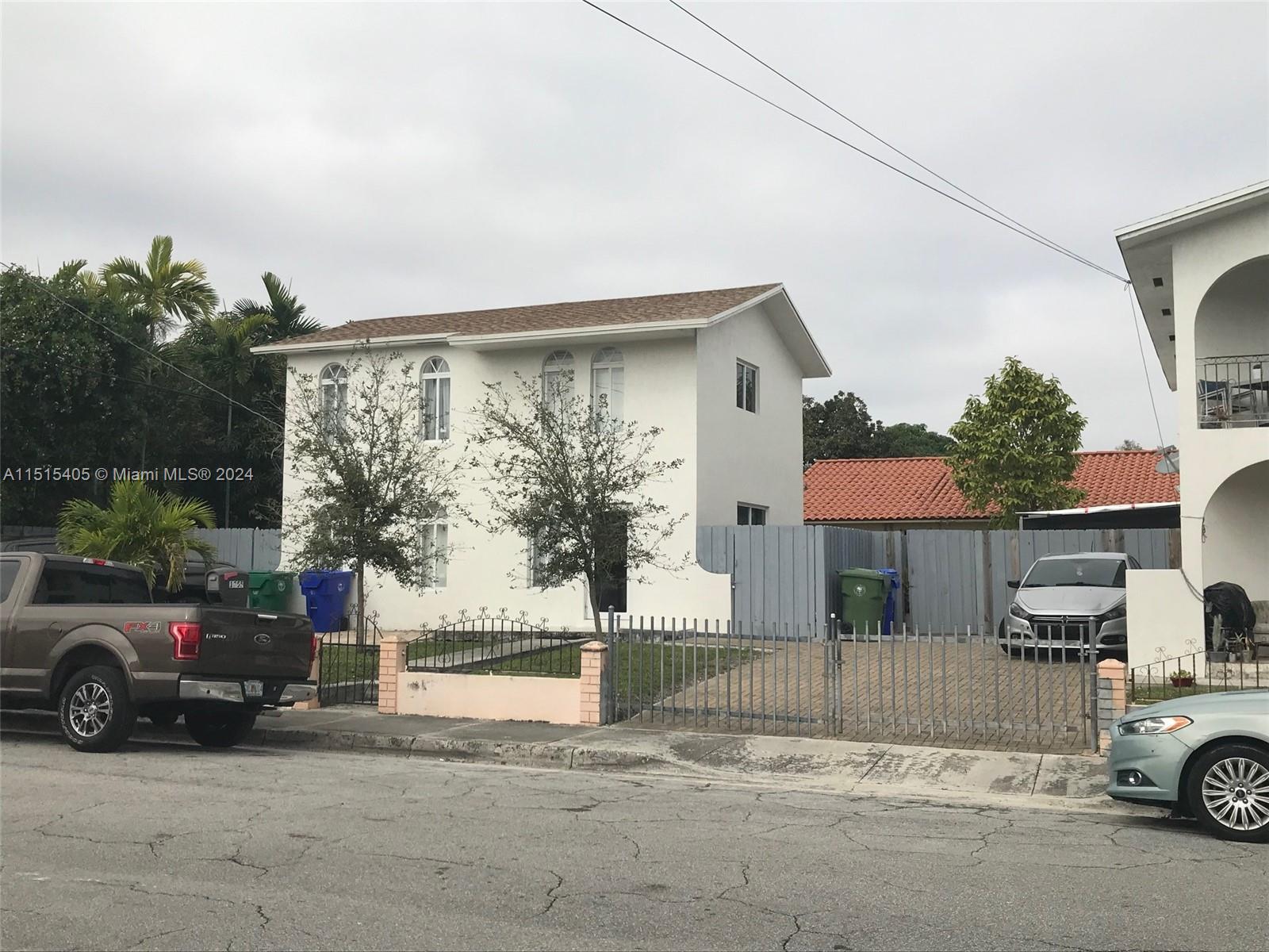 1355 Southwest 12th Street Miami, FL 33135 - Photo 10 of 18 a view of a car park in front of house