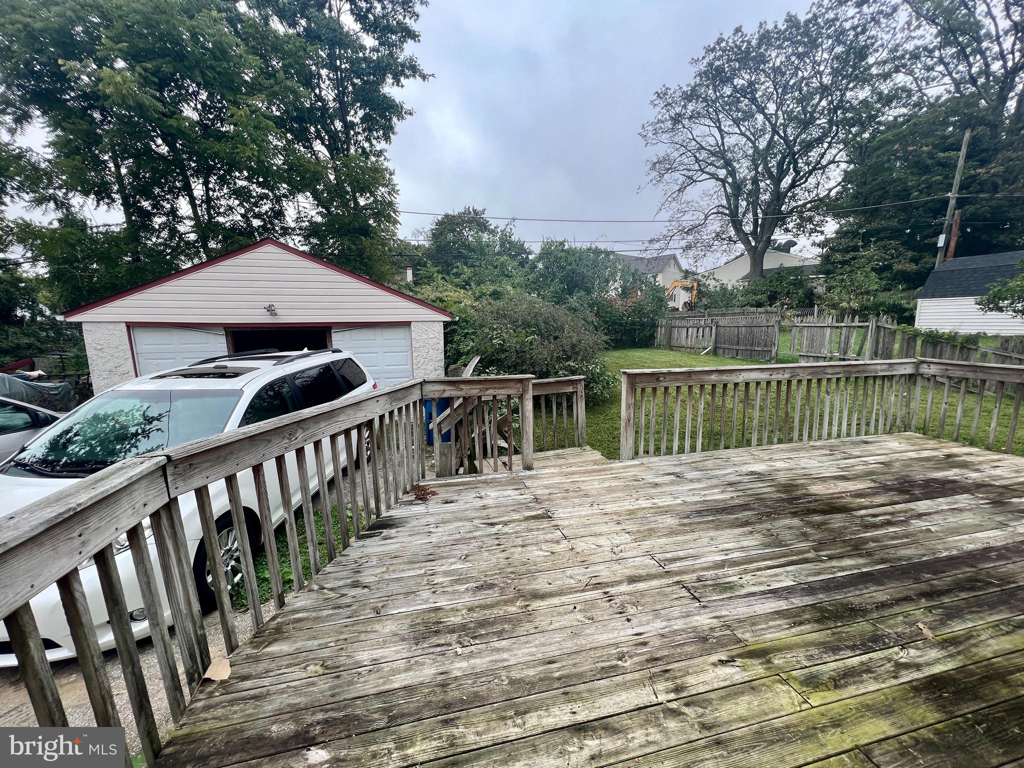 841 Maple Avenue Berwyn, PA 19312 - Photo 14 of 14 a view of a wooden deck and trees with wooden fence