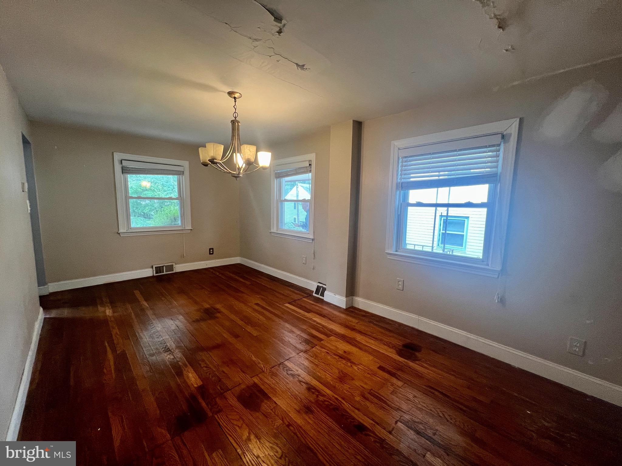 841 Maple Avenue Berwyn, PA 19312 - Photo 2 of 14 an empty room with wooden floor and windows