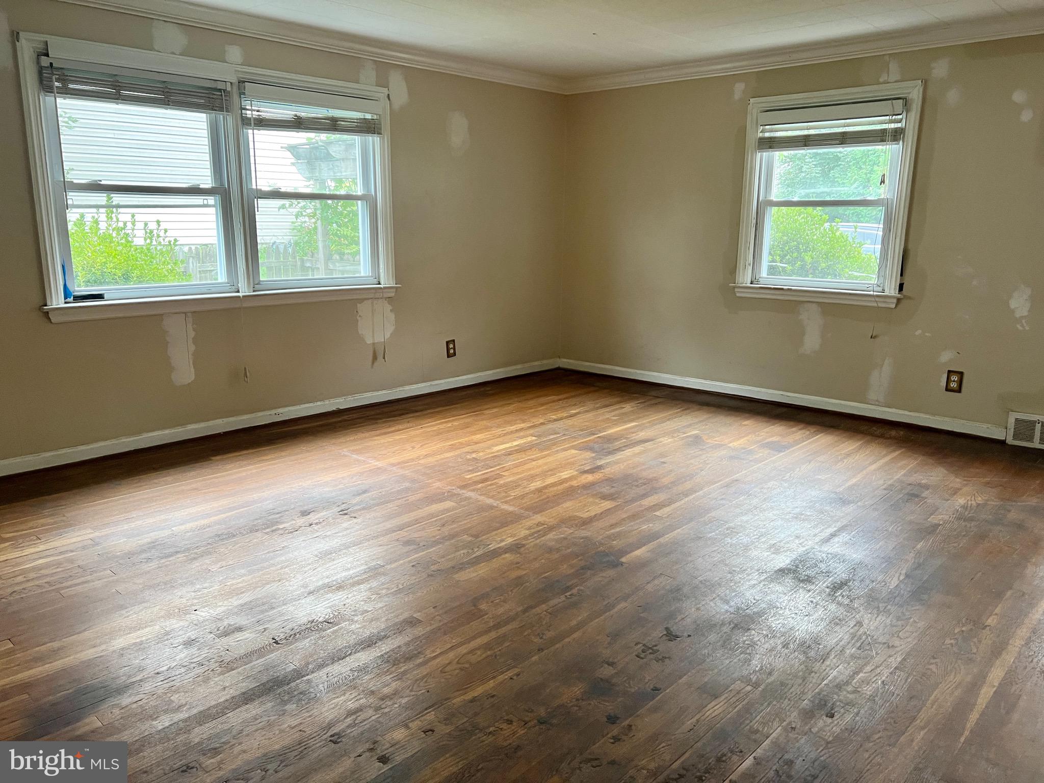 841 Maple Avenue Berwyn, PA 19312 - Photo 7 of 14 an empty room with wooden floor and windows