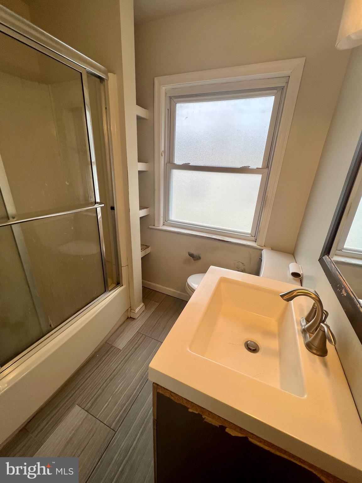841 Maple Avenue Berwyn, PA 19312 - Photo 9 of 14 a bathroom with a sink and a window