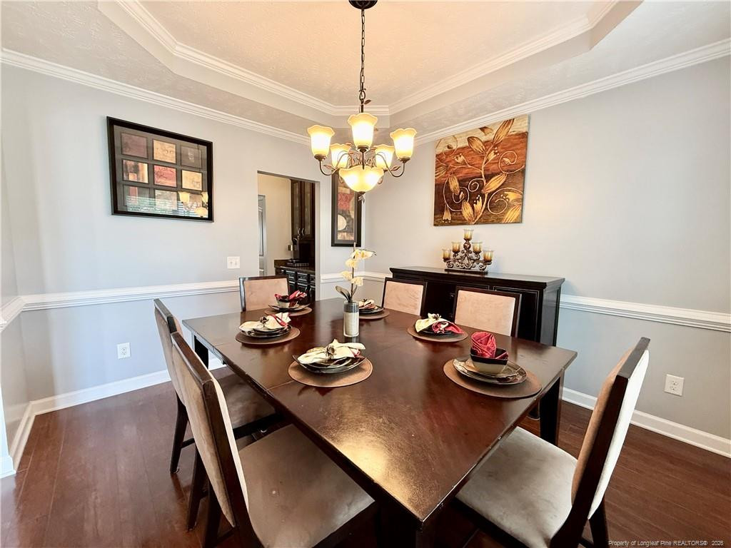 35 Ambrose Point Cameron, NC 28326 - Photo 7 of 31 a view of a dining room with furniture a chandelier and wooden floor