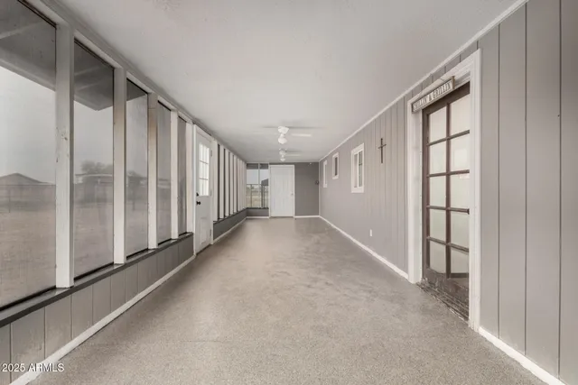 a view of a big room with windows