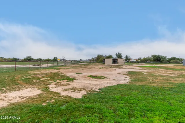 a view of a lake with houses in the back