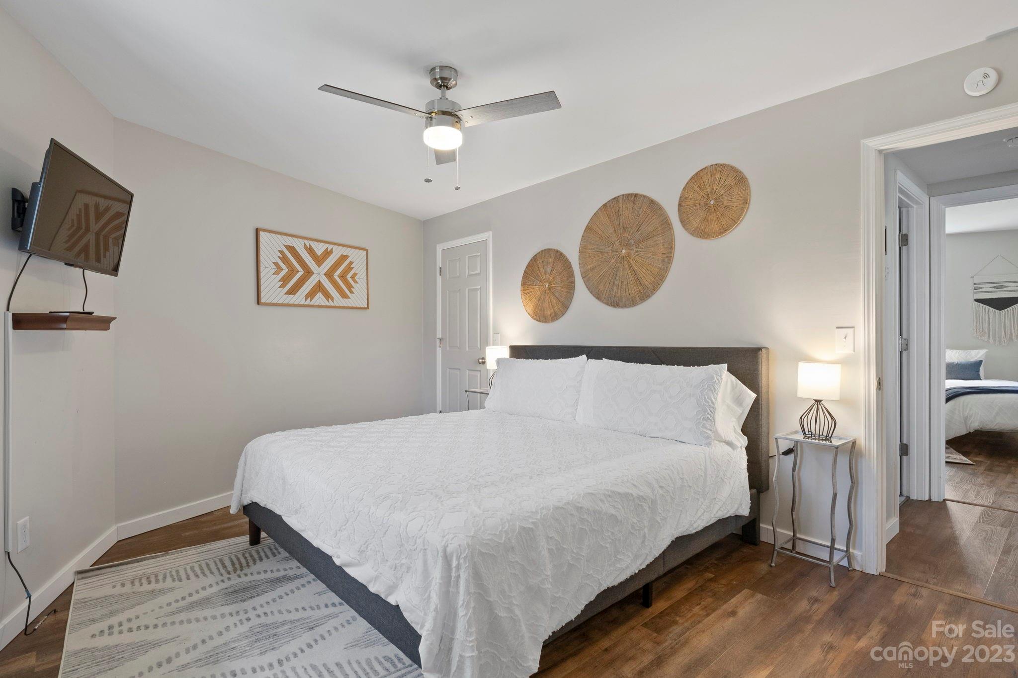 180 Hemlock Loop Maggie Valley, NC 28751 - Photo 19 of 28 a bedroom with a bed and a window