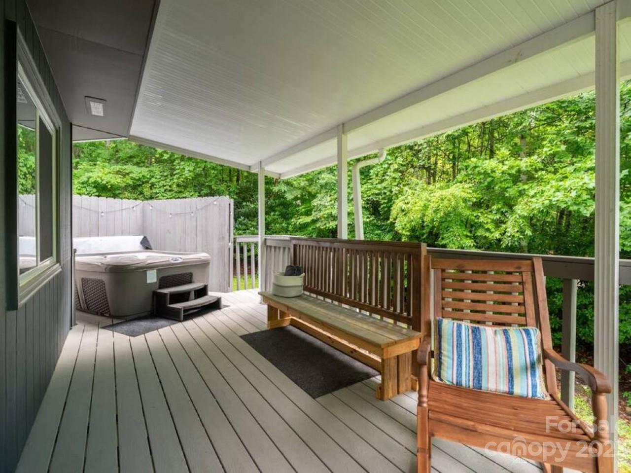 180 Hemlock Loop Maggie Valley, NC 28751 - Photo 27 of 28 a view of balcony with wooden floor and outdoor seating
