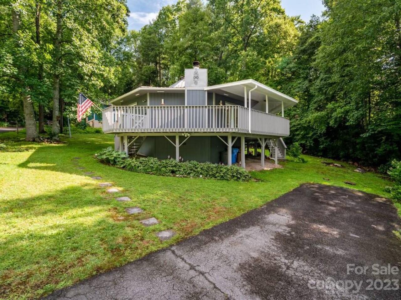 180 Hemlock Loop Maggie Valley, NC 28751 - Photo 3 of 28 a front view of a house with a yard