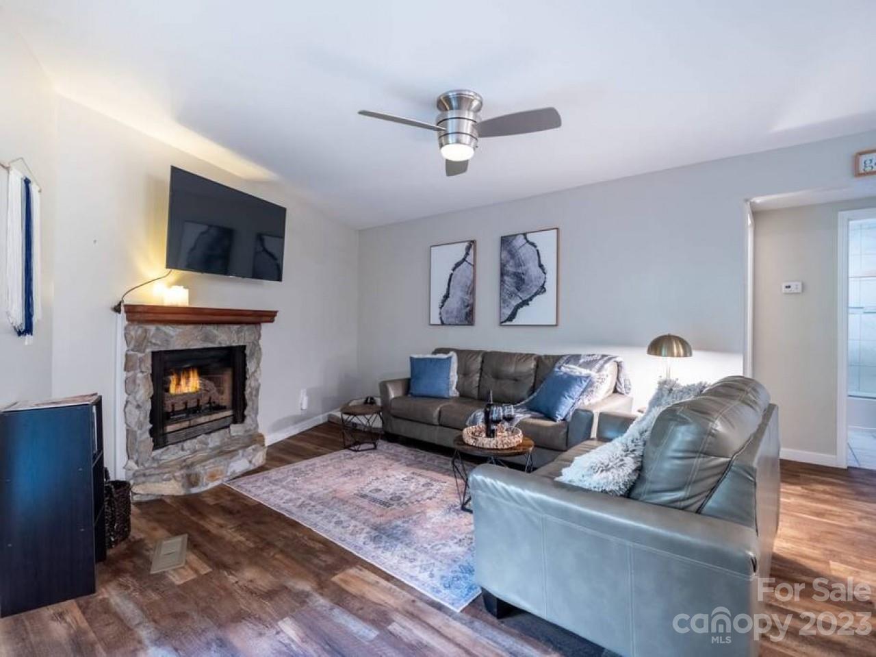 180 Hemlock Loop Maggie Valley, NC 28751 - Photo 4 of 28 a living room with furniture and a fireplace