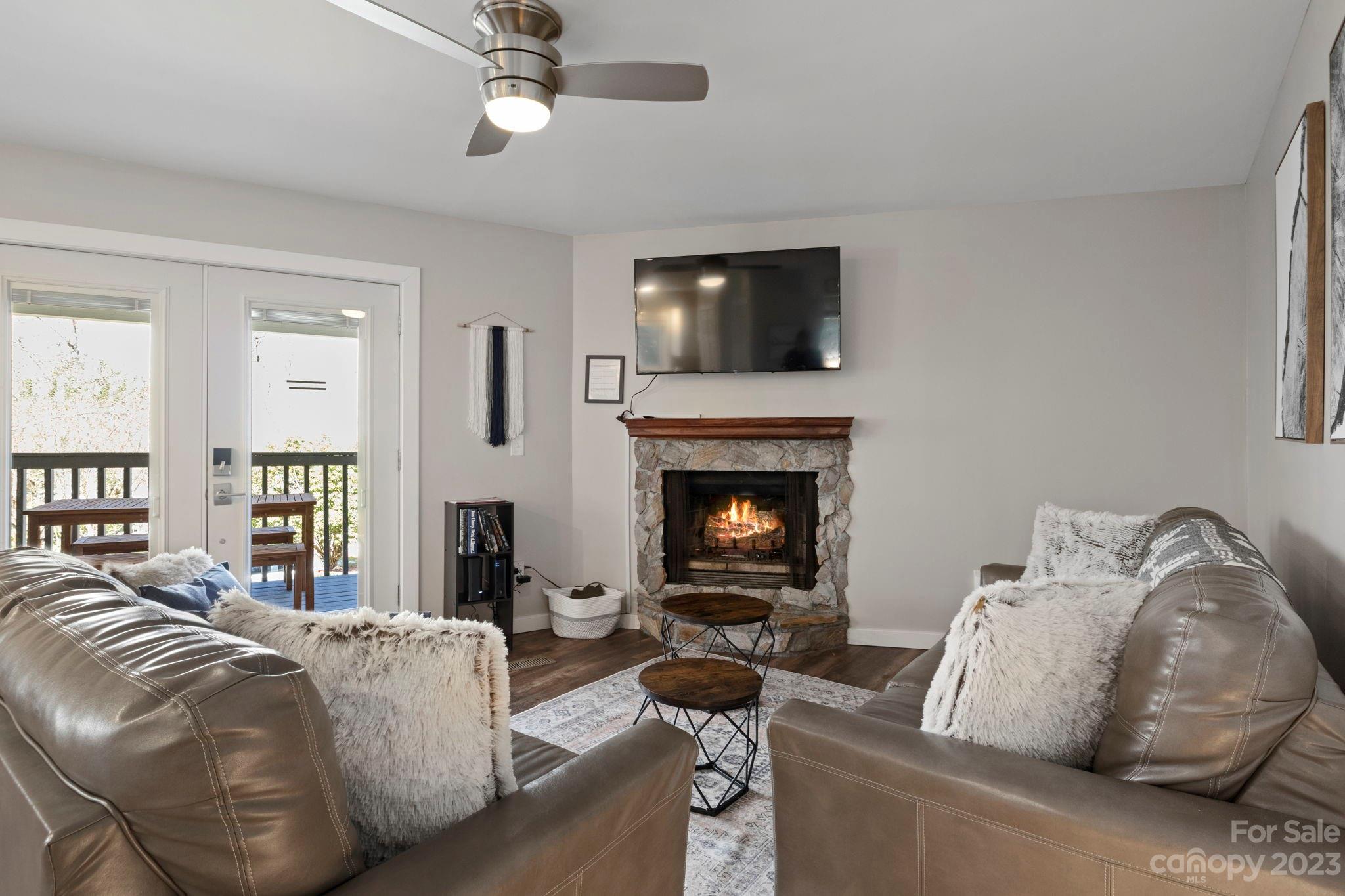 180 Hemlock Loop Maggie Valley, NC 28751 - Photo 5 of 28 a living room with furniture and a fireplace