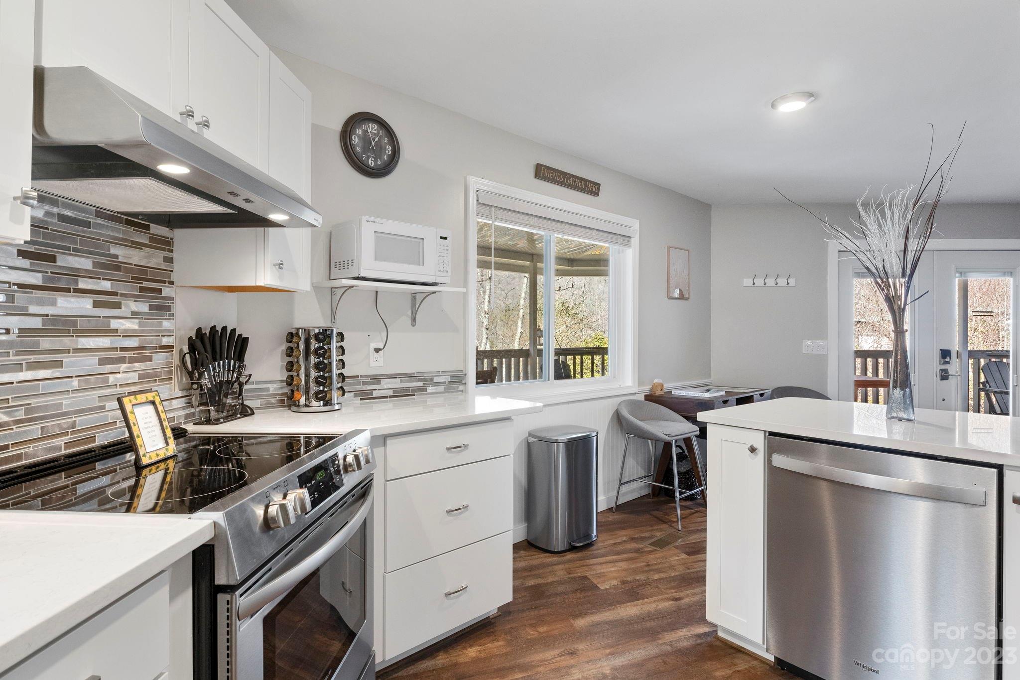 180 Hemlock Loop Maggie Valley, NC 28751 - Photo 8 of 28 a kitchen with a sink stove and cabinets