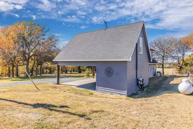 a backyard of a house with yard and staircase