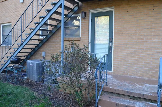 a view of entryway with wooden floor and a yard