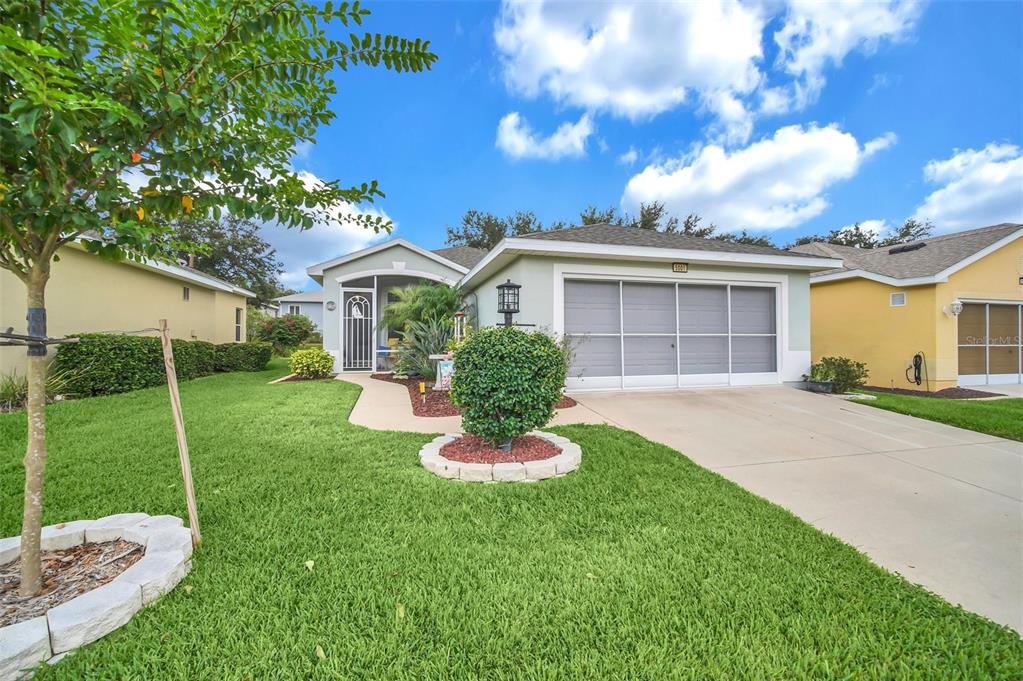 5001 Rainbow Trout Road Tavares, FL 32778 - Photo 1 of 1 Welcome Home! 5001 Rainbow Trout welcomes you with a nicely landscaped yard.