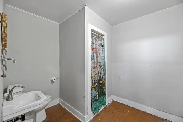 a bathroom with a sink and a window