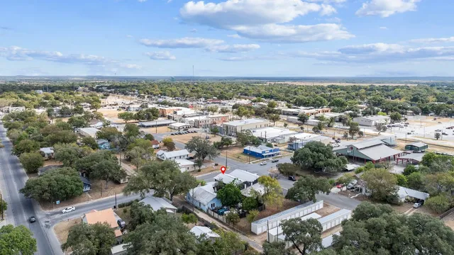 an aerial view of a houses with outdoor space