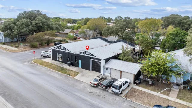 an aerial view of a house with a garden