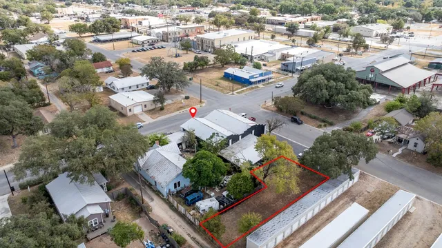 an aerial view of residential houses with outdoor space