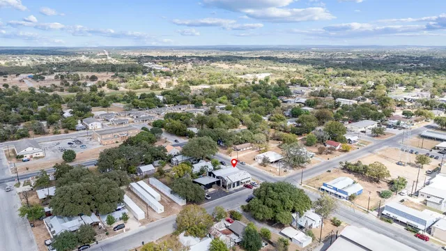 an aerial view of residential building with green space