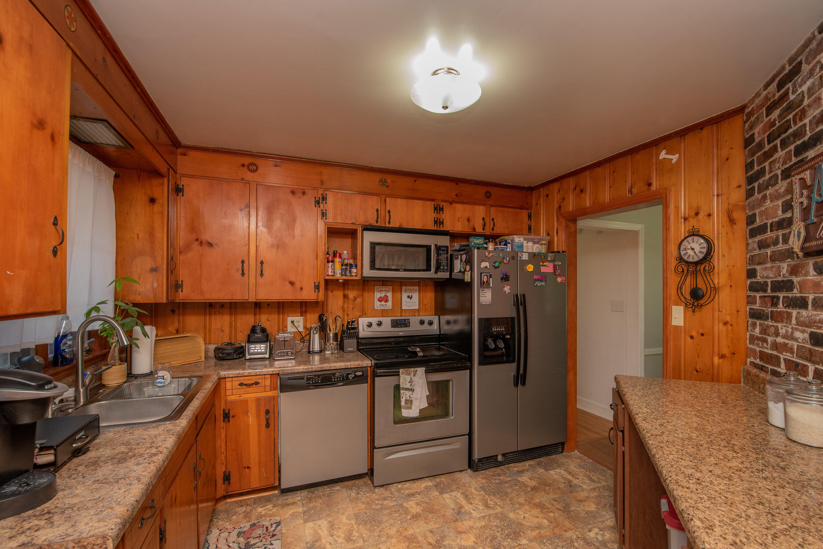 114 Gyles Road Southwest Aiken, SC 29803 - Photo 12 of 35 a kitchen with stainless steel appliances granite countertop a stove top oven a sink a refrigerator and cabinets
