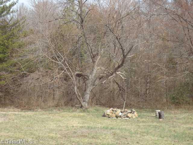 7003 Turnpike Road High Point, NC 27263 - Photo 15 of 16 Exterior Front. Rock Fire Pit off deck