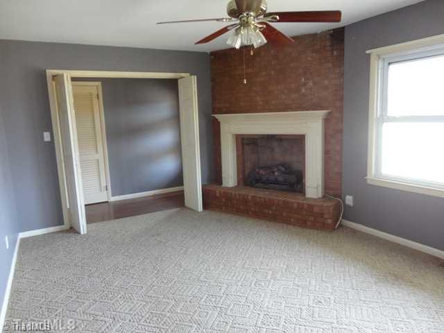 7003 Turnpike Road High Point, NC 27263 - Photo 3 of 16 Living Room. Corner gas fireplace