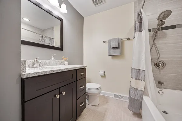 a living room with a bed furniture and a window