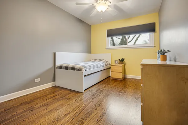 an empty room with wooden floor