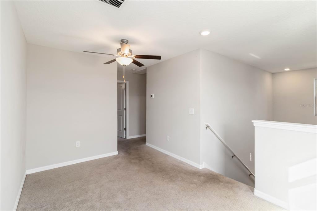 1777 Fred Ives Street Ruskin, FL 33570 - Photo 13 of 35 a view of a chandelier fan in a room