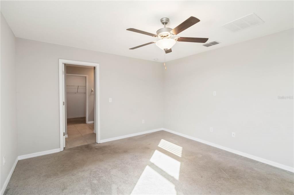 1777 Fred Ives Street Ruskin, FL 33570 - Photo 14 of 35 an empty room with a window and a fan