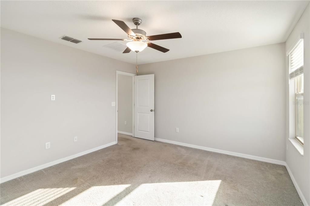 1777 Fred Ives Street Ruskin, FL 33570 - Photo 15 of 35 a view of an empty room with a window